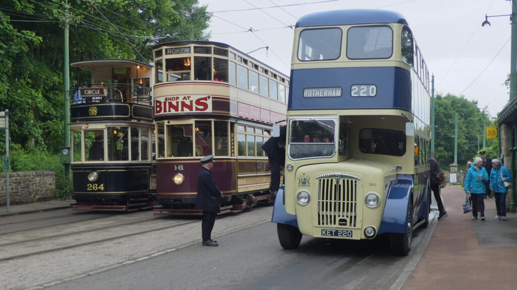 Double decker busses and trams belonging to 1950s